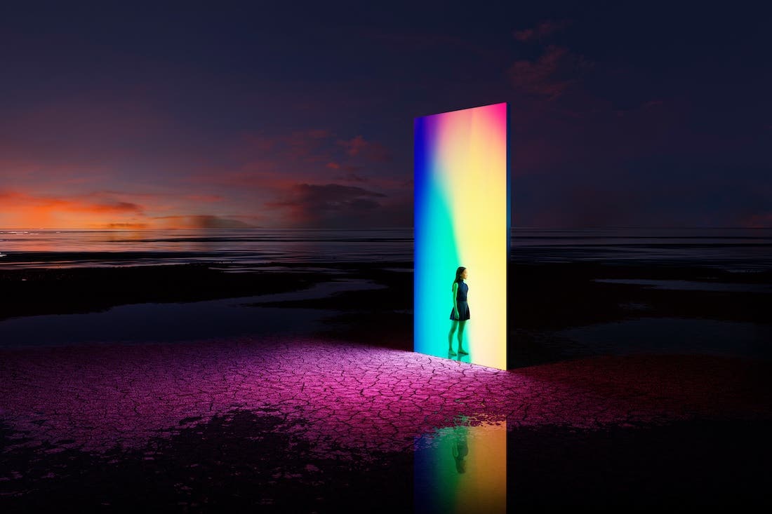 Digital generated image of young woman standing on entrance of multicoloured portal door. Metaverse concept.